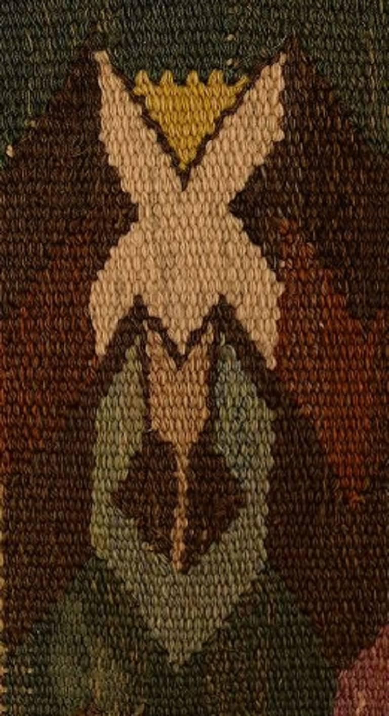 Marta Maas-Fjetterström, Sweden, b. 1873, d. 1941,

Handwoven carpet, wool, "rölakan" technique. "Tappan"

Signed monogram MMF.

Woven with green, red, brown and blue fields.

Designed in the 1930s. 

Made before 1941 by Marta
