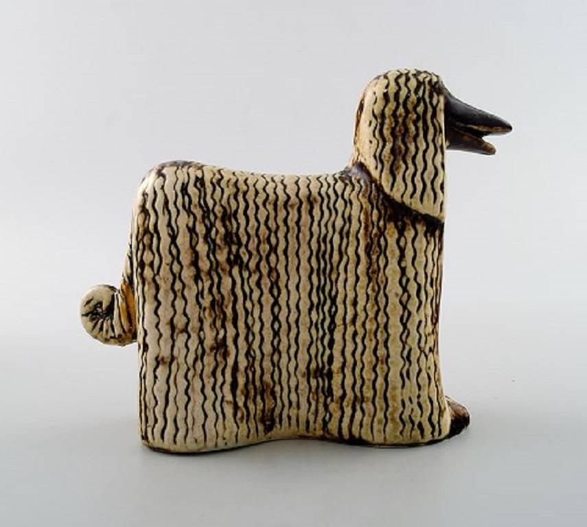 Lisa Larson ceramics, two Afghan dogs, Afghan Hound.

Lisa Larson is a Swedish ceramic designer who started in Gustavsberg Porcelain Factory in 1953. 

Lisa Larson is best known for her humorous and friendly characters.

Measures: 15 cm. x