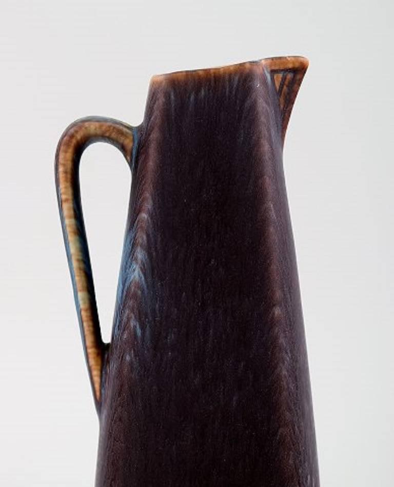 Gunnar Nylund, Rörstrand/Rorstrand vase or pitcher in ceramics.

Beautiful glaze.

In perfect condition. 1st factory quality.

Measures: 18 x 7 cm.

Marked.