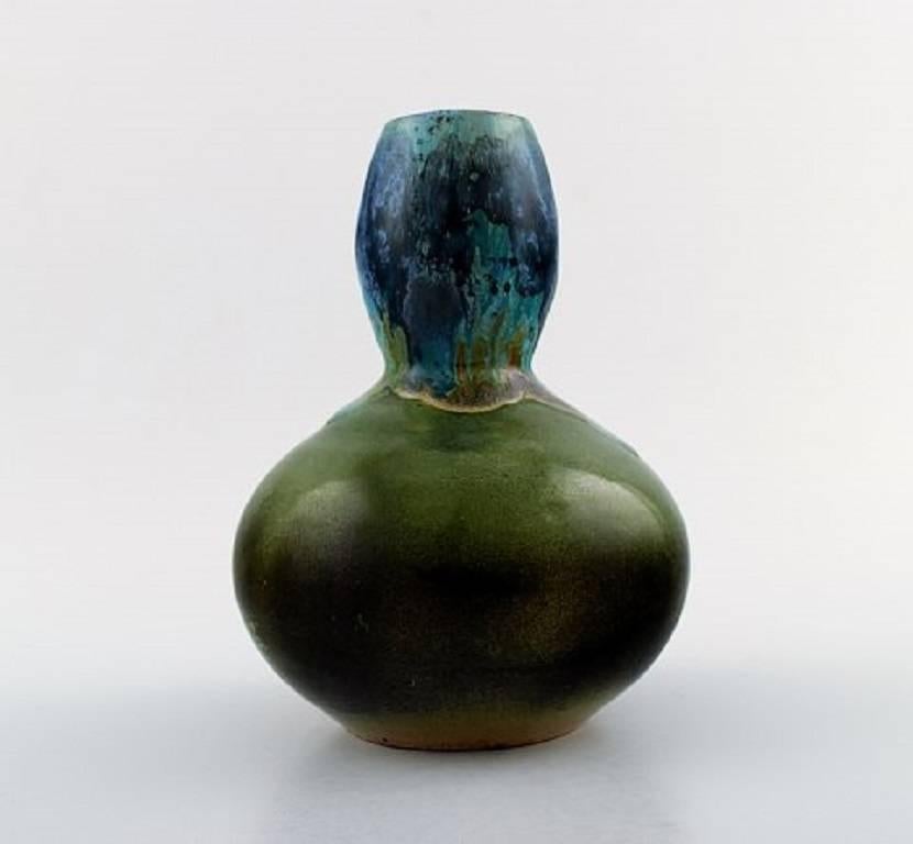 L. Cagnat, French ceramist, 1930s-1940s.

Art Deco gourd-shaped ceramic vase. Unique work.

Beautiful polychrome glaze.

Signed.

In perfect condition.

Measures: 19 cm. x 14 cm.