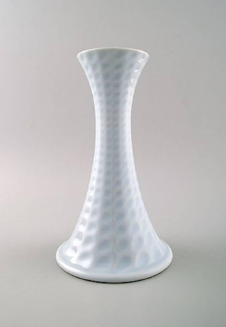 Royal Copenhagen porcelain pair of candlesticks.

Beautiful glaze in light blue shades.

Stamped.

2nd factory quality, in very good condition.

Measures 20 cm.