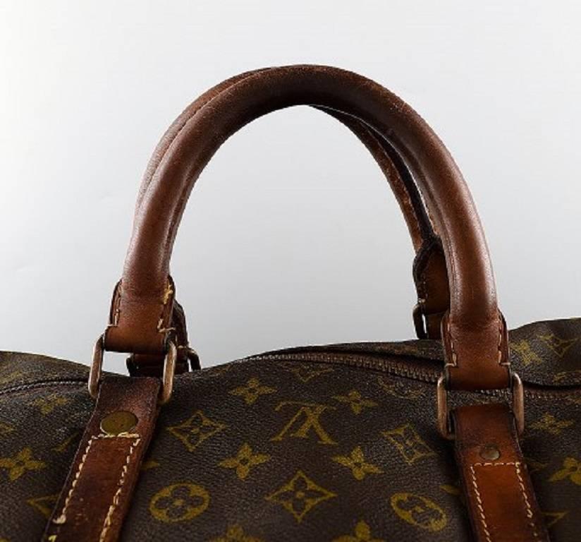 Louis Vuitton vintage monogram Keepall 55.

This travel duffel is crafted of sturdy traditional Louis Vuitton monogram on toile canvas with vachetta cowhide leather straps and reinforced top handles with durable brass hardware. 

The top brass