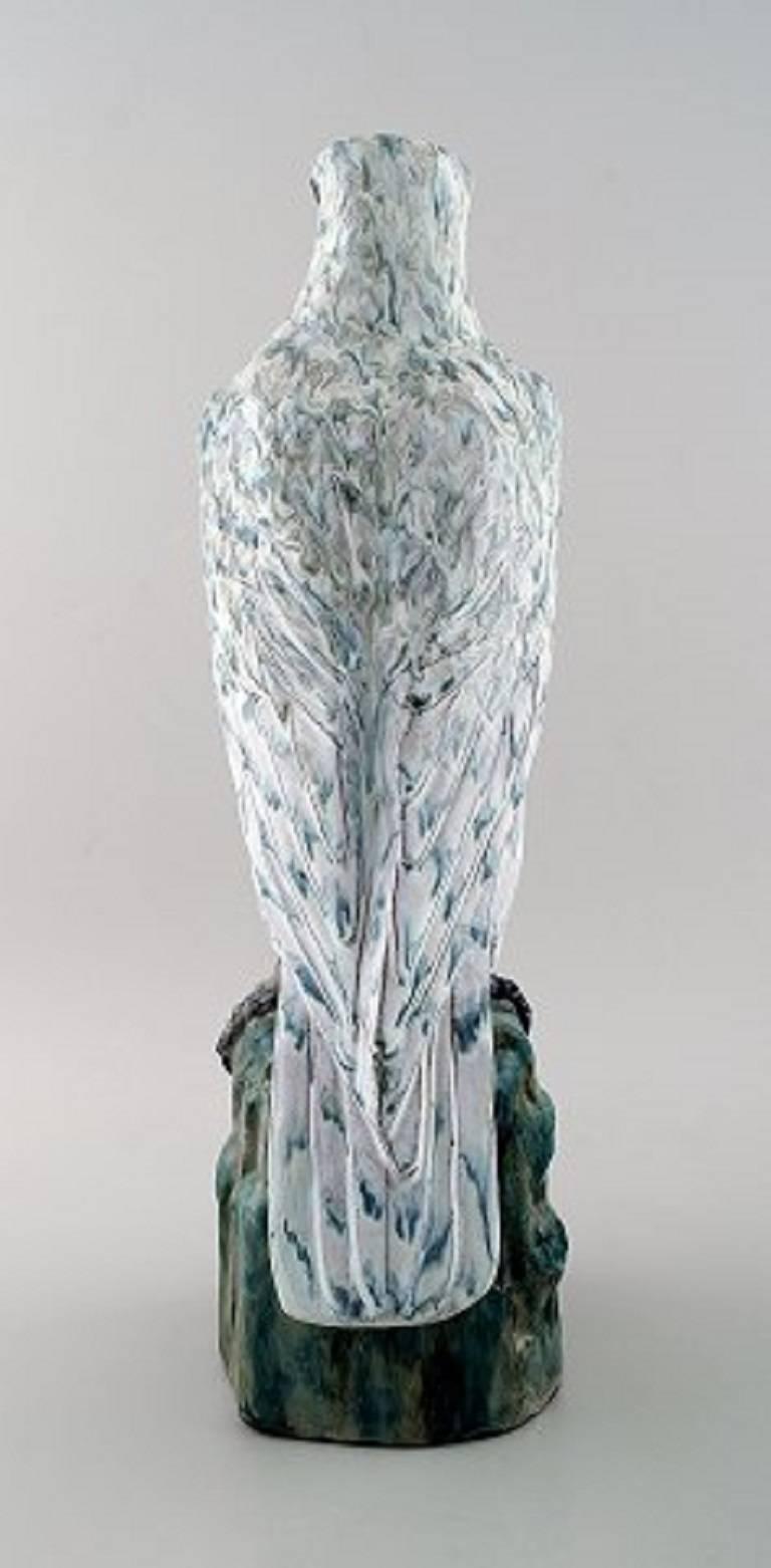 Gudmundur Einarsson March b. Middal 1895 d. 1963.

Icelandic falcon of pottery decorated with gray, green, brown and white glaze with luster.

Signed in monogram GE, Iceland, 1956.

Measures: 47 cm. x 14 cm.