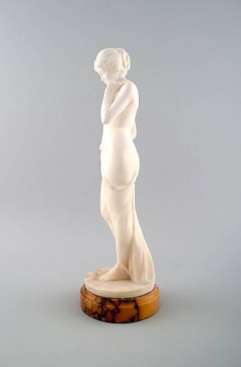 Large figure of naked woman in alabaster on marble base.

Early 20th century unknown artist.

Signed: Sinter, EH.

Measures: 32.5 cm. x 9 cm.

In perfect condition.