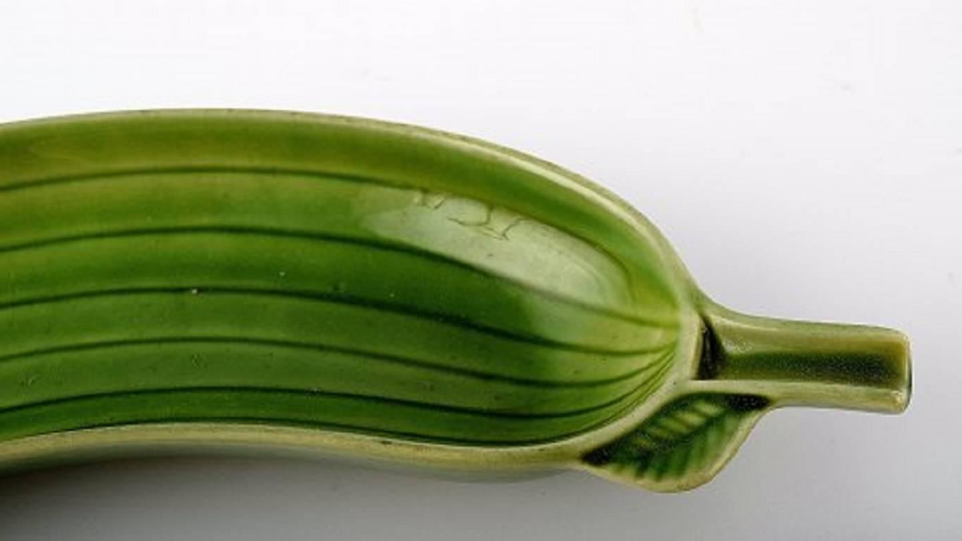 Three Stig Lindberg, Gustavsberg. Cucumber dishes. 

Measures: 31 cm. stamped. 

In good condition, hairline crack.