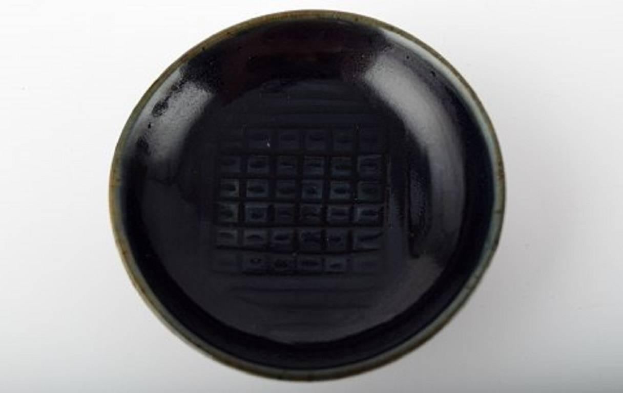 Unique Royal Copenhagen Gerd Bogelund, ceramic bowl in olive green and black glaze.

 Measures: 8.5 cm x 3 cm.

 In perfect condition, First factory quality.