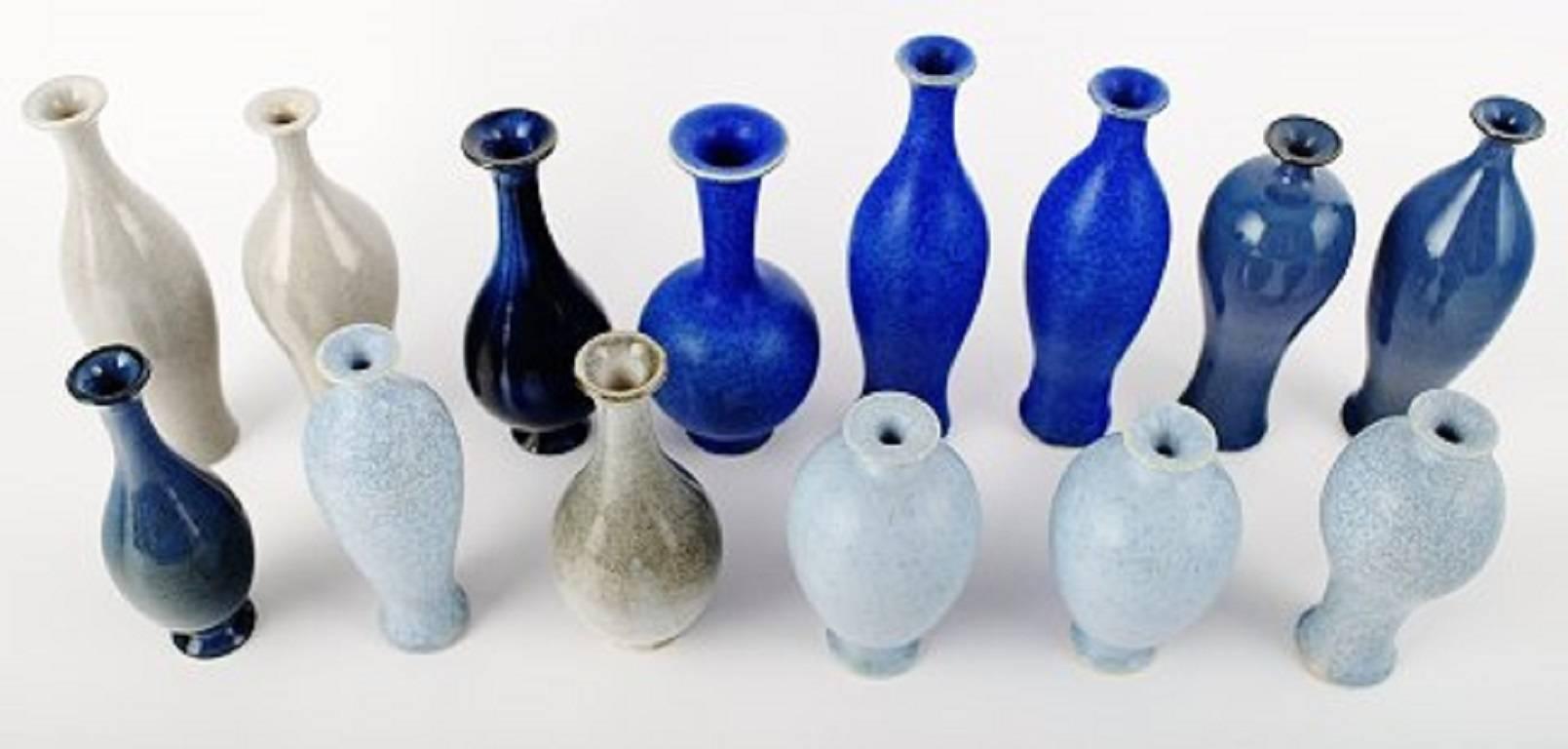 Collection of 14 unique miniature ceramic vases by Per Liljegren.

Signed. 

In perfect condition. 

Swedish design. 

Beautiful glazes.

Height from 8.5 cm to 14 cm.