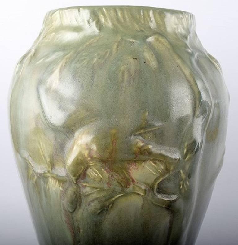Large Höganäs Art Nouveau ceramic vase. Bird on branch in relief.

Stamped 