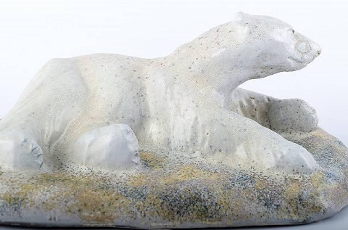 Large and impressive Danish private collection (Total of 42 unique vases, bowls, figurines, etc.) Soren Kongstrand 1872-1951) and Jens Petersen (1890-1956). 

Large polar bear sculpture, Jens Petersen , signed JP. 

Measuring: 30 x 14 cm. 

In