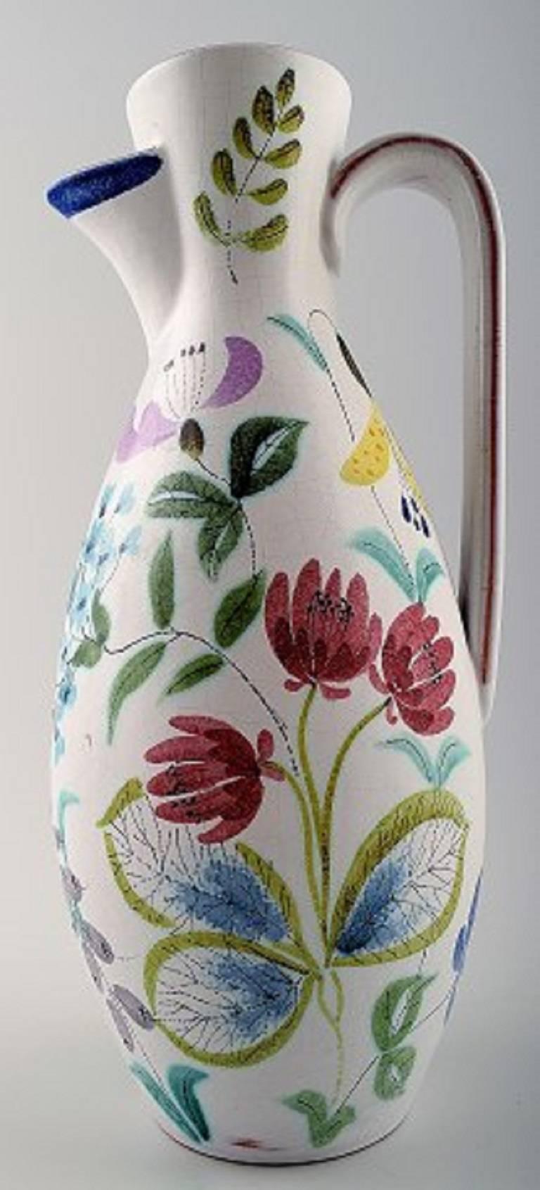 Stig Lindberg for Gustavsberg. Earthenware jug, retro 1940s-1950s.

With colorful hand-painted decoration. 

Signed.

In good condition. Measures: 26 cm.