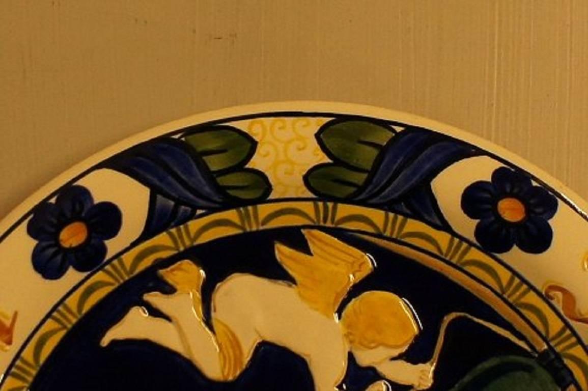 Grande assiette de Noël 1910 en alumine et en faïence.

En très bon état.

Mesures : 30 cm. de diamètre.