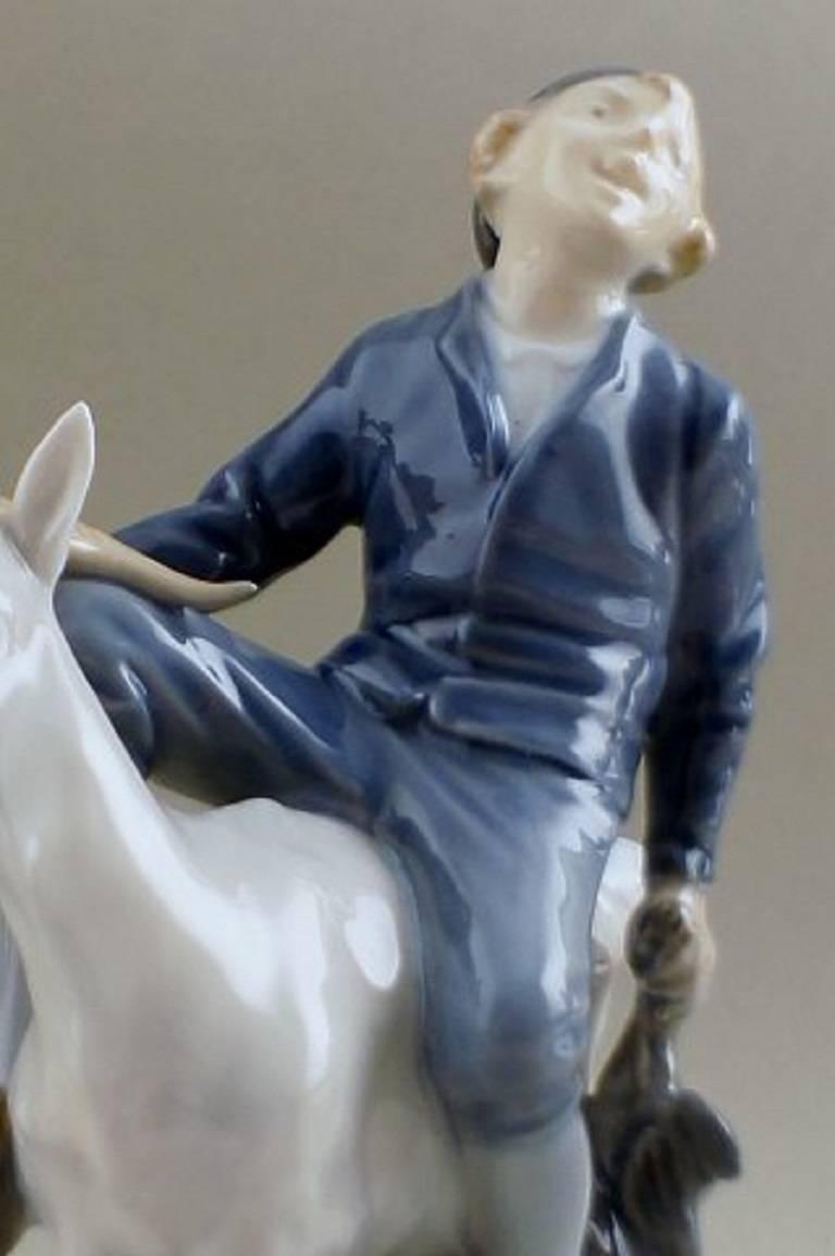 Royal Copenhagen figurine Hans Clodhopper, Boy on Goat # 1228. 

Designed by: Christian Thomsen.

Factory first. In mint condition. 

18 cm. tall.