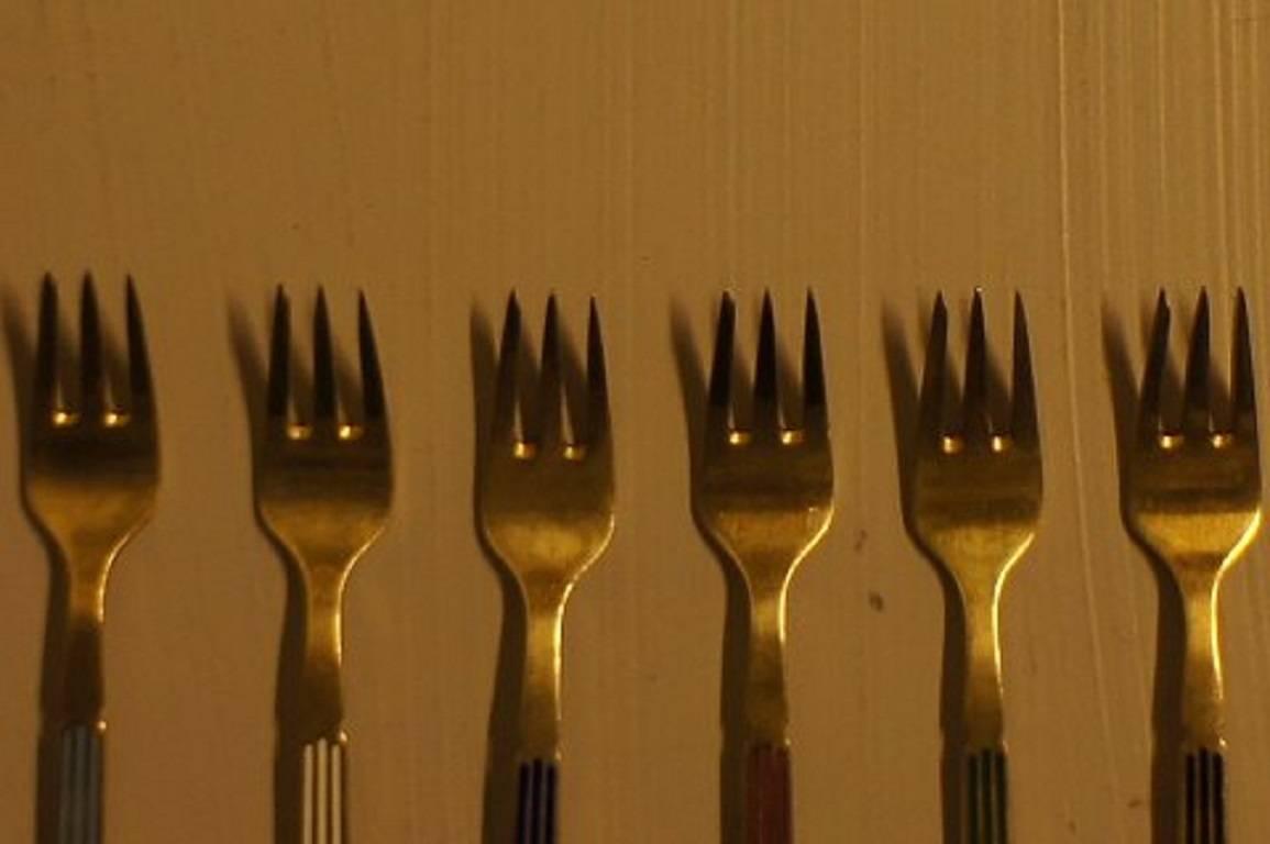 Six piece, A. Michelsen, Copenhagen sterling silver cake forks "harlequin."

In very good condition. 

12 cm. long.