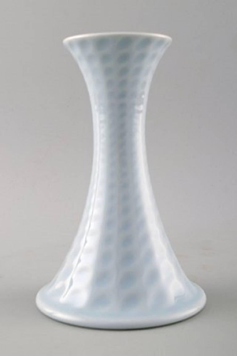 Royal Copenhagen porcelain pair of candlesticks.

Beautiful glaze in light blue shades.

Stamped.

2nd factory quality, in very good condition.

Measures 15 x 11 cm.