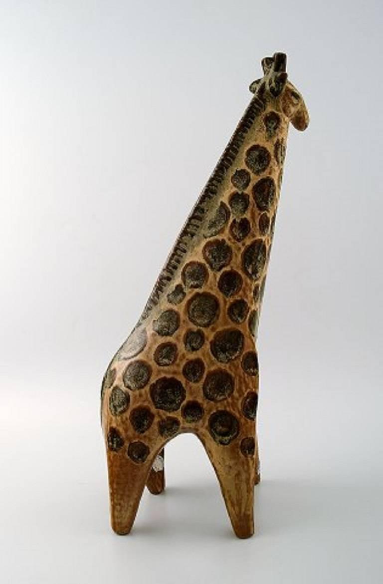 Lisa Larsson zoo figures, two giraffes.

Gustavsberg Swedish glazed pottery figurines.

Large beautiful giraffe.

Measures: Height 38 cm.

Designed By Lisa Larsson.

Perfect condition.

Lisa Larson (b. 1931) was educated in Gothenburg