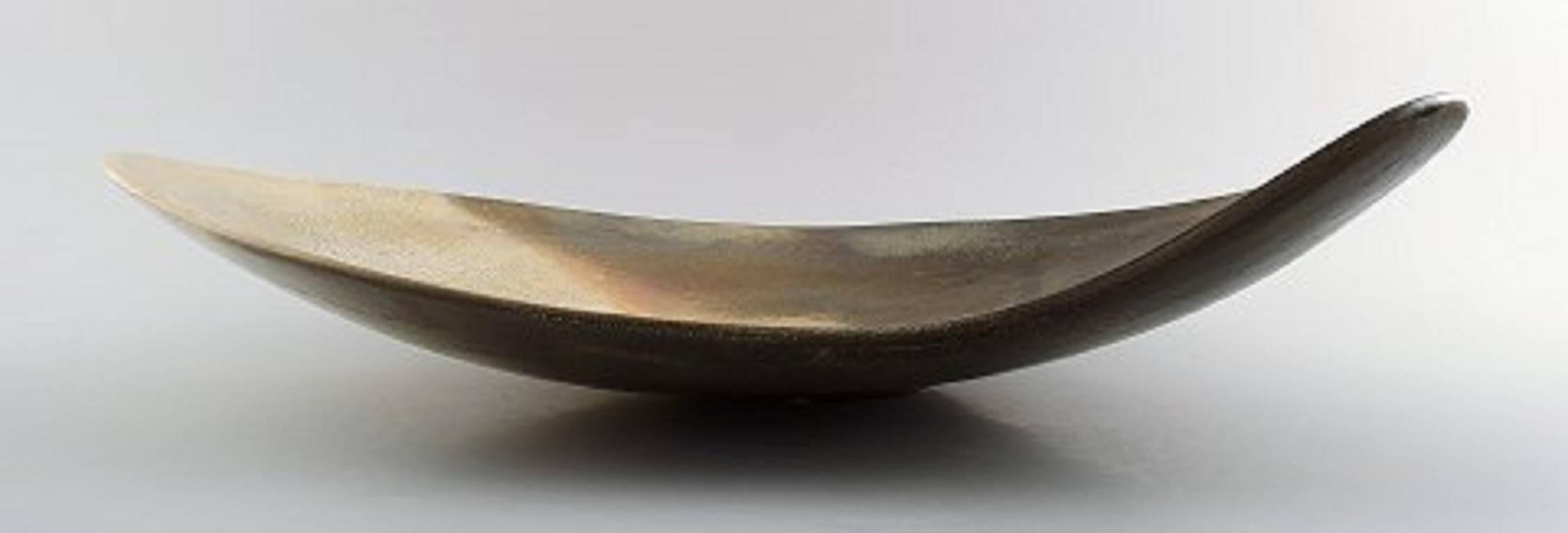 Hans Hedberg (1917-2007), Swedish ceramist.

Unique very large kidney shaped ceramic dish from Hedberg's own workshop in Biot, south of France, circa 1960s.

Hedberg worked with several famous artists, among Picasso, Léger and