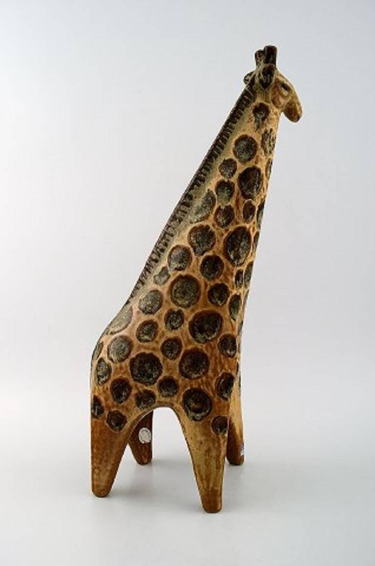 Lisa Larsson zoo figure, liraffe.

Gustavsberg Swedish glazed pottery figurine.

Large beautiful giraffe.

Measures: Height 38 cm.

Designed By Lisa Larsson

Perfect condition.

Lisa Larson (b. 1931) was educated in Gothenburg and worked