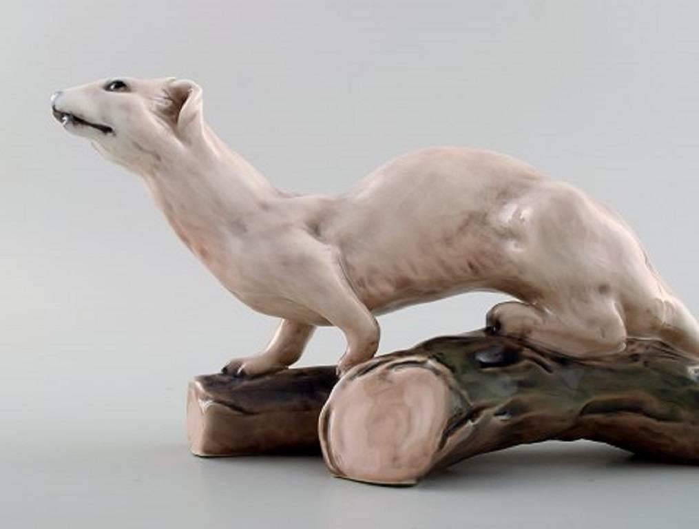 Dahl Jensen number 1121 ermine or stoat porcelain figurine.

Measures 23 cm.

1st. factory. In perfect condition.
