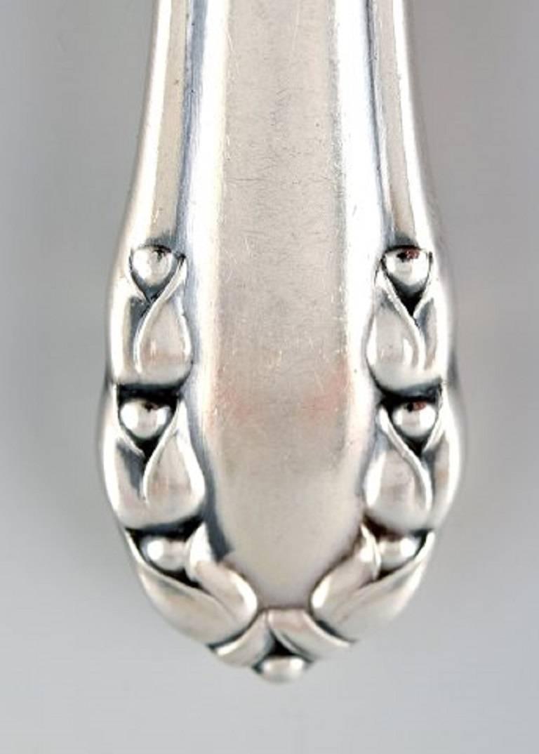 10 pcs. Georg Jensen three towers silver 830s. Lily of the valley cutlery.

10 fruit knives, length 15.3 cm

Very good condition, ordinary wear.

Designed by Georg Jensen in 1913

Early stamp.