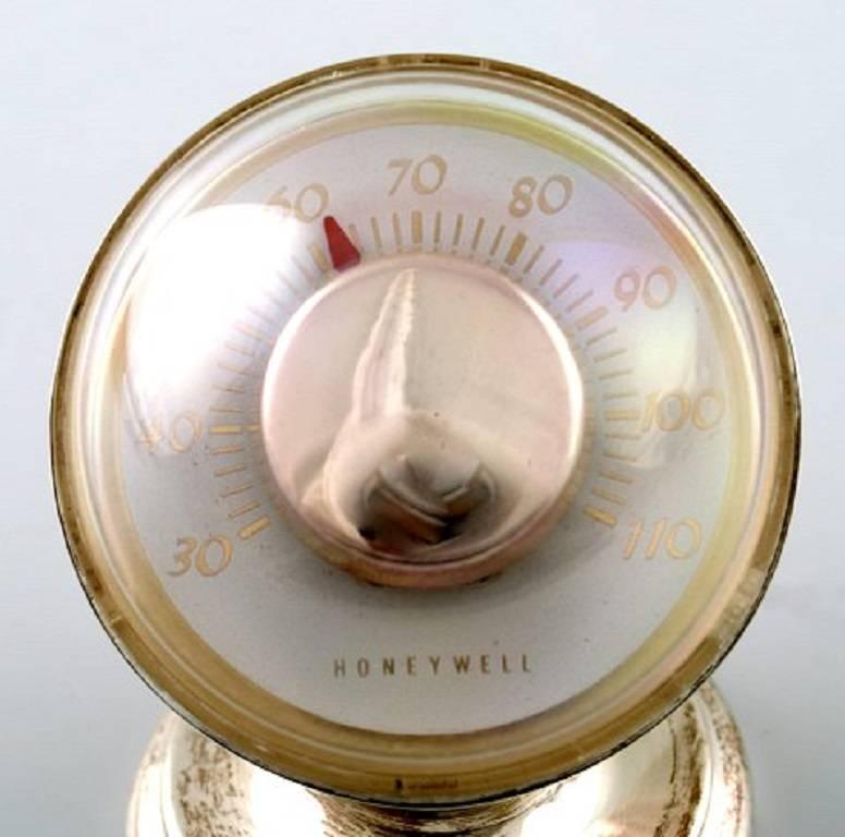 Mid-Century Modern, sterling silver desk thermometer, Tiffany & Co., New York, circa 1950s-1960s. 

Measures: 3" high x 2" diameter. 

Made by Honeywell.

In working order. Excellent condition.