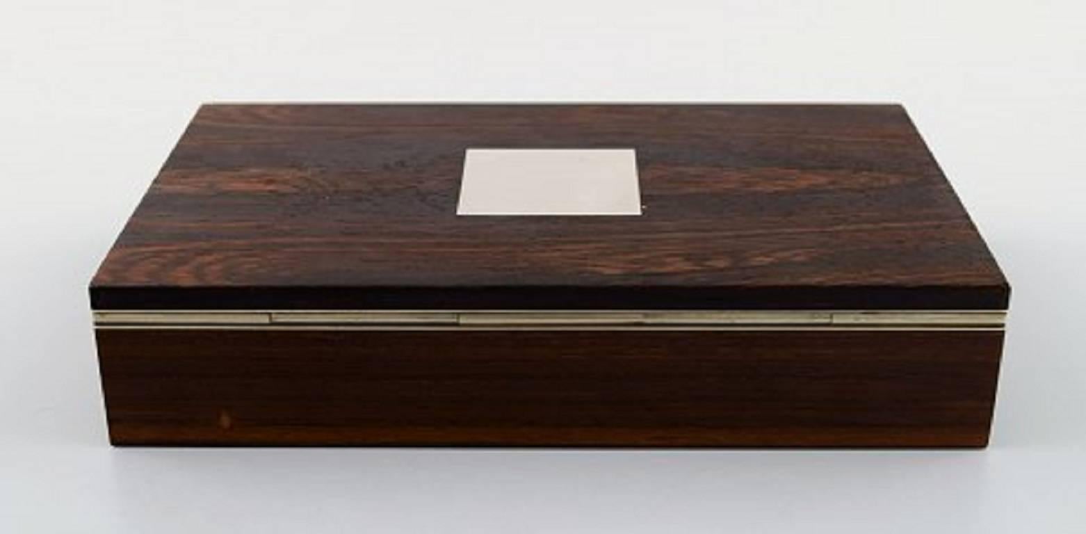 Hans Hansen, casket / box in rosewood inlaid with silver.

Marked Hans Hansen. 

Mid-20th century. Danish design.

Measures: 18 cm. x 11 cm. x 3.5 cm.

In perfect condition.
