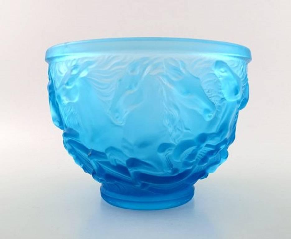 Art Deco Lalique style art glass bowl in turquoise with horses in relief.

Unsigned.

circa 1950s.

Size: 20 cm. high. 15 cm. in diameter.

In perfect condition.