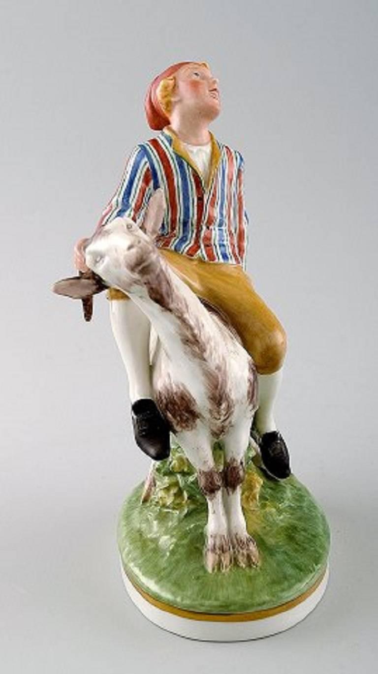 Royal Copenhagen, Julian Marie's mark. 

Porcelain figure decorated in overglaze, 'Clumsy Hans' No. 1228. 

After fairytale by H. C. Andersen.

Measures 18 cm. x 15 cm.

1st. factory quality. In perfect condition.