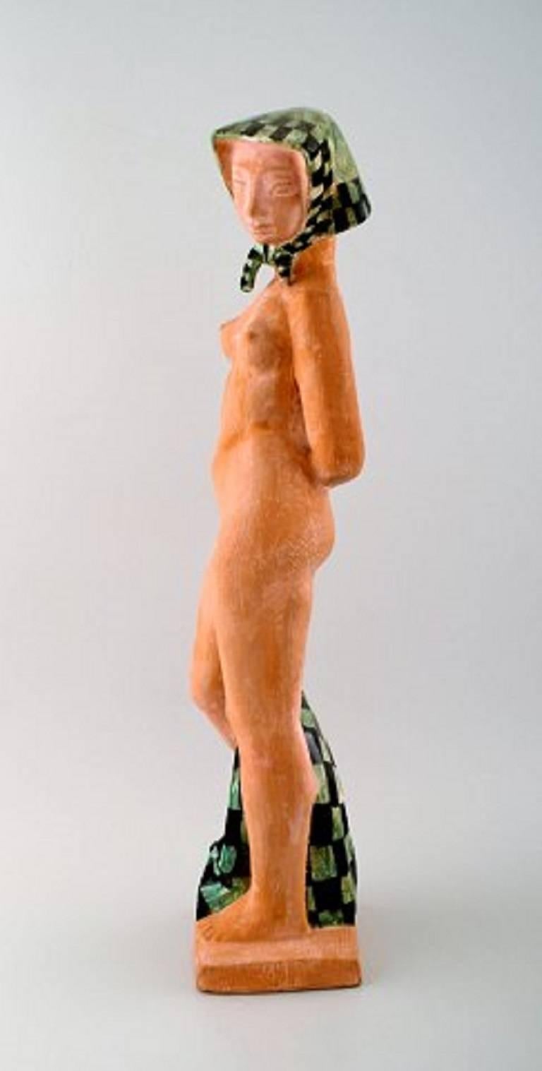 Helge Christoffersen, own workshop, very large unique figure of nude young model wearing scarf.

High quality ceramic sculpture, beautiful glaze.

Measures 49 x 13 cm.

In perfect condition.

Signed.