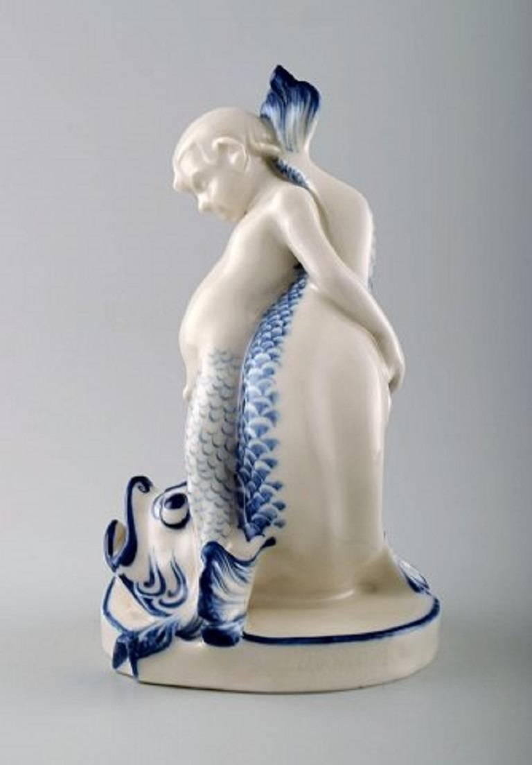 Rare Rörstrand porcelain figure, sea boy and fish.

Measures 19 cm. X 11 cm. 

1. factory quality, in perfect condition. 

Stamped.