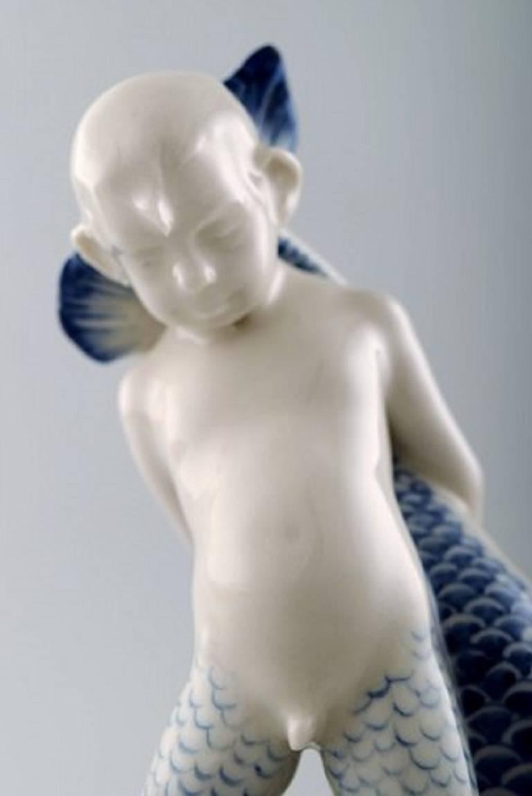 Rare Rörstrand Porcelain Figure, Sea Boy and Fish In Excellent Condition For Sale In Copenhagen, DK