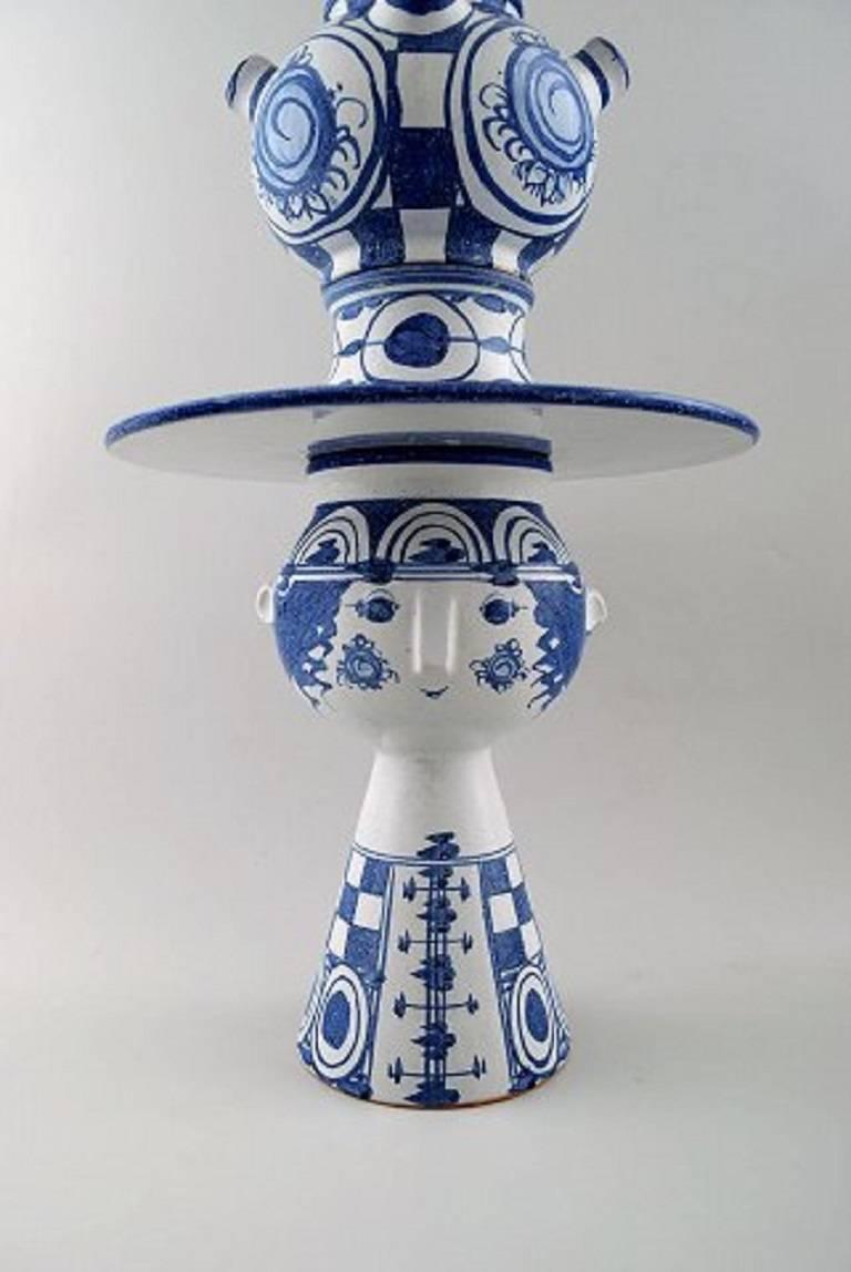 Bjørn Wiinblad, five-piece vase hand decorated in blue pottery, woman with hat.

Signed. Monogram, V30 and dated 1974.

Measure: Height 62 cm.

In perfect condition.