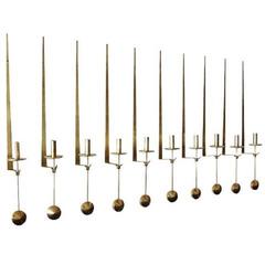 Pierre Forsell, Ten "Pendulum" Wall-Mounted Brass Candlesticks