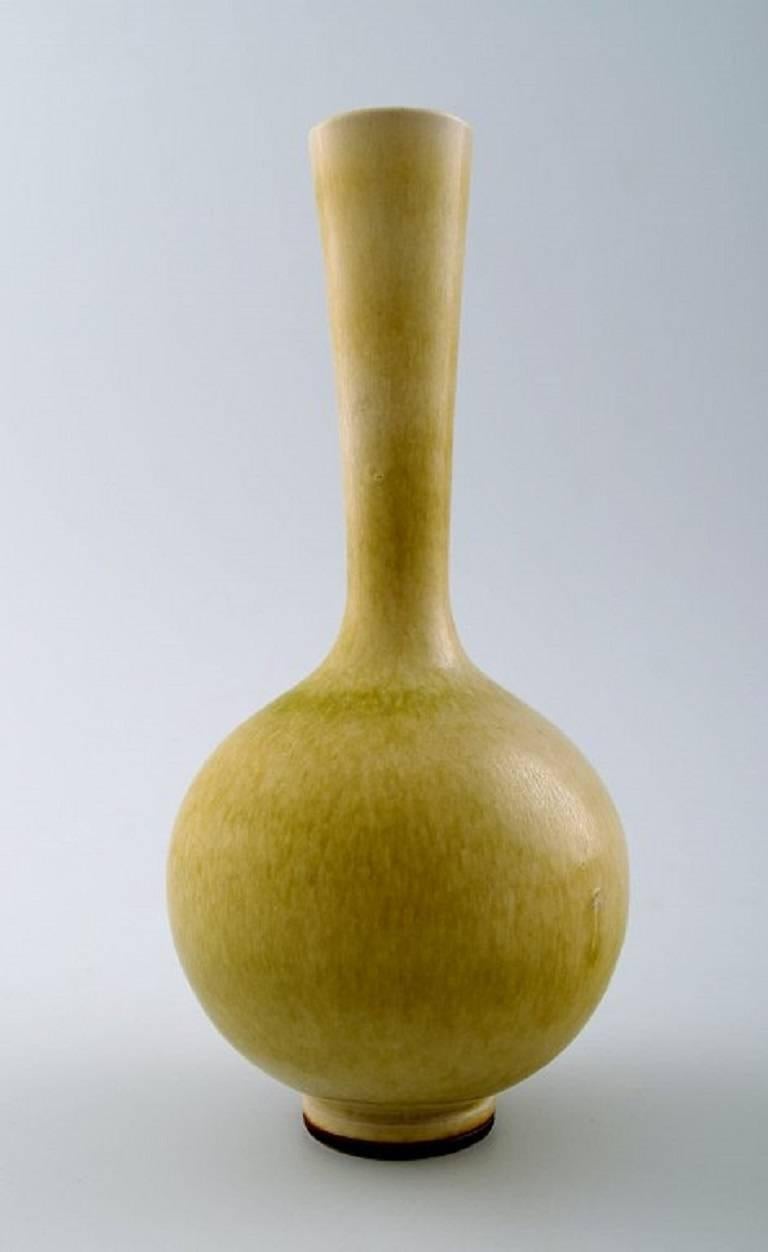 Berndt Friberg Studio ceramic vase. Modern Swedish design. 

Unique, handmade.

Beautiful glaze in yellow shades.

Perfect condition. 1st. factory quality.

Measures: 16 x 7 cm.