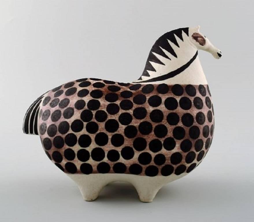 Rare Gustavsberg Studio hand, horse by Stig Lindberg, Swedish ceramist.

Size: 16 cm. long. 13 cm. high.

Stamped: Gustavsberg, and with studio hand.

In perfect condition.