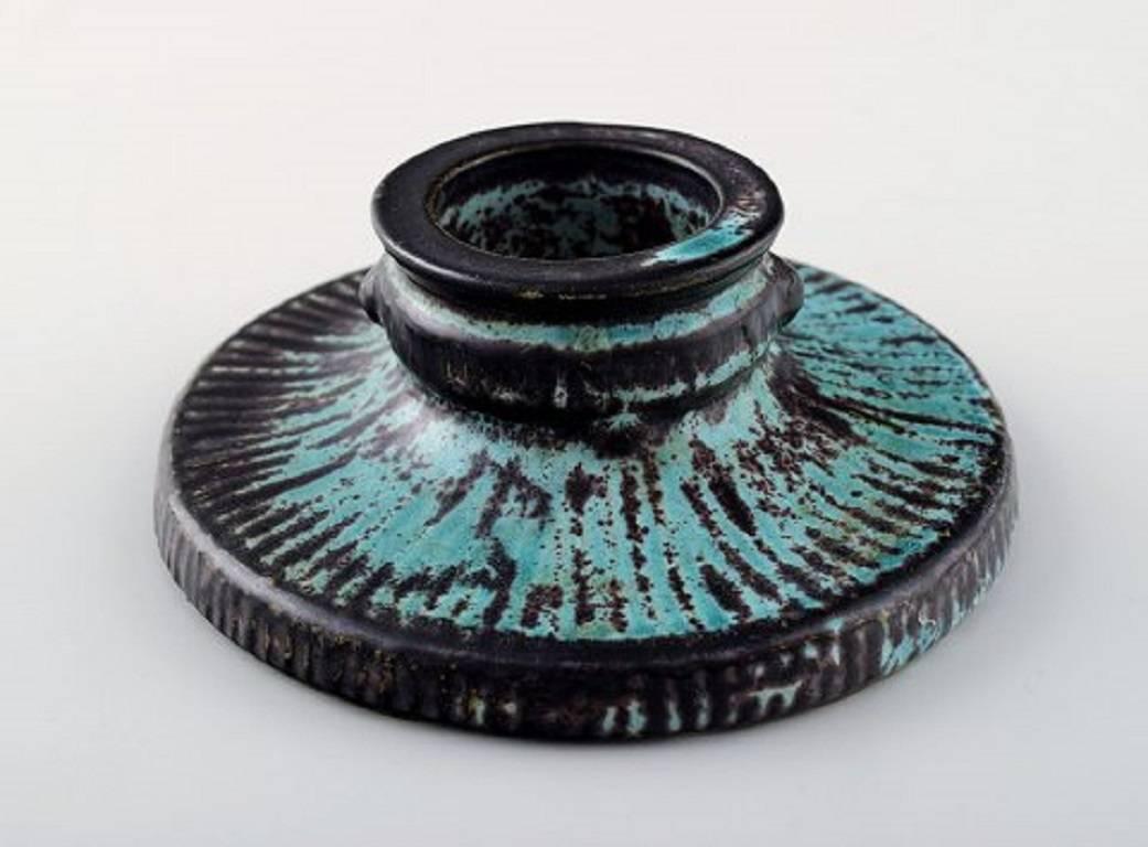 Svend Hammershøi for Kähler, Denmark, glazed candlestick, 1930s.

Designed by Svend Hammershøi. 

Glaze in black and green.

Measures 13 x 5 cm.

Marked.

In perfect condition.