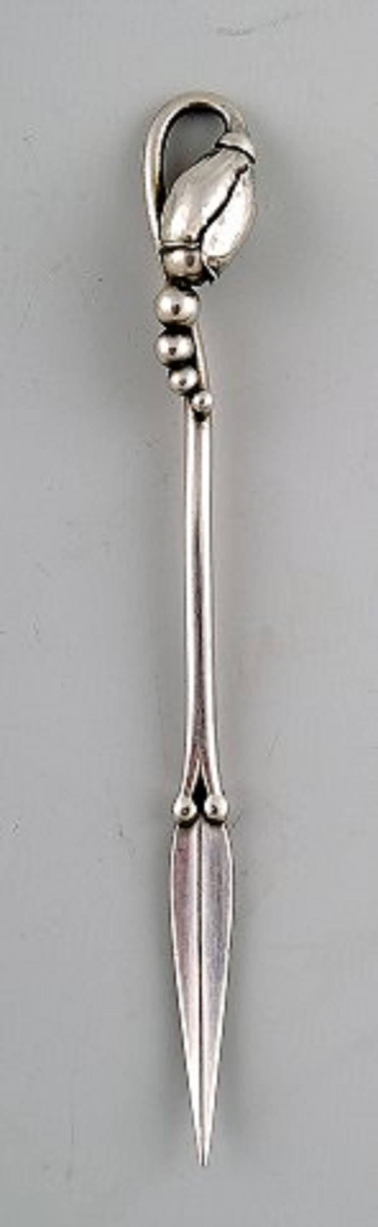Georg Jensen five nutpickers of sterling silver, 'Magnolia', 1915-1930.

In perfect condition.

Stamped GI.

Measures 9.5 cm.