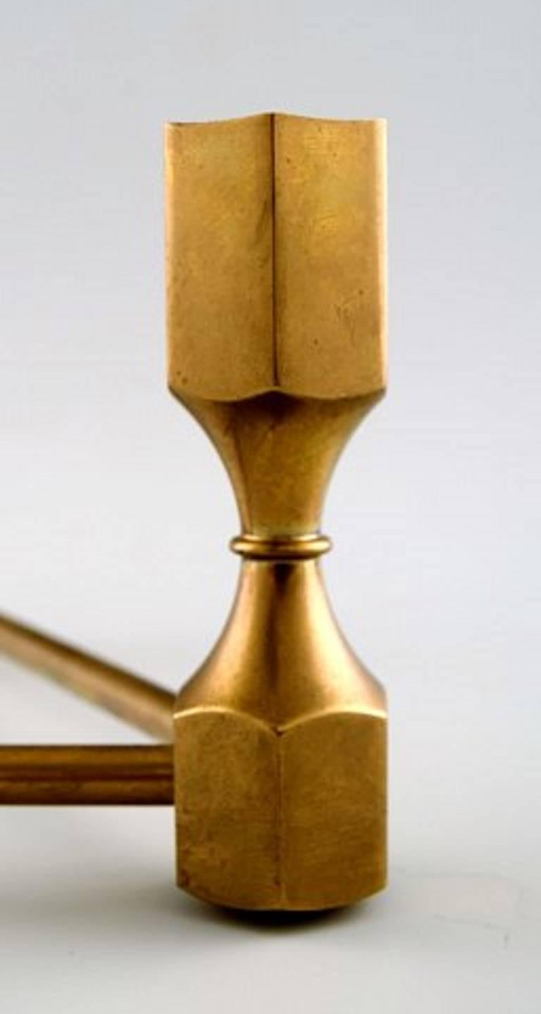 Gusum metal candleholder in brass for three light.

Swedish design.

Measures: 21 cm. X 9.5 cm.

In perfect condition.