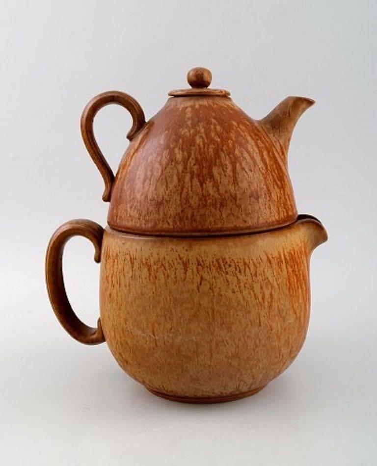 Rörstrand / Rorstrand tea set in pottery by Gunnar Nylund.

Tea pot in two parts with associated water jug.

Beautiful glaze in brown shades.

In perfect condition, 1st. factory quality.

Tea pot measures: 17 cm. in diameter, 11 cm. high.