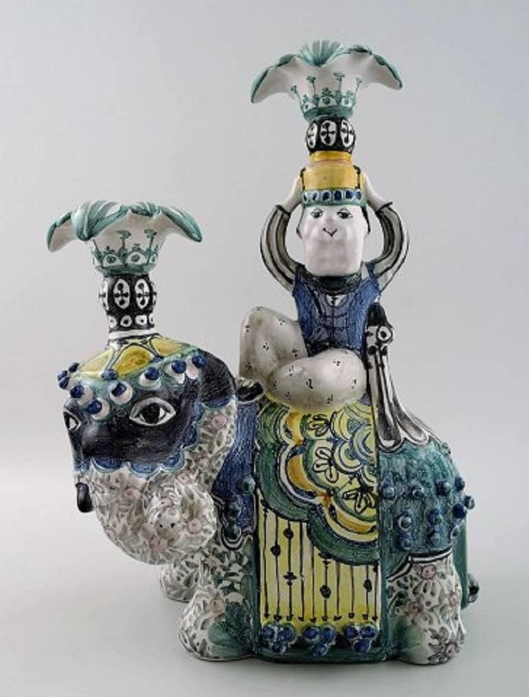 Bjorn Wiinblad, 1918-2006, Unique Figurines in the form of King Solomon and the Queen of Saba riding elephants, of glazed ceramics.

Signed: Bjørn Wiinblad 1985 and 1986.

Measure: Height 33.5 cm x length 23 cm x diameter 18 cm.

In perfect