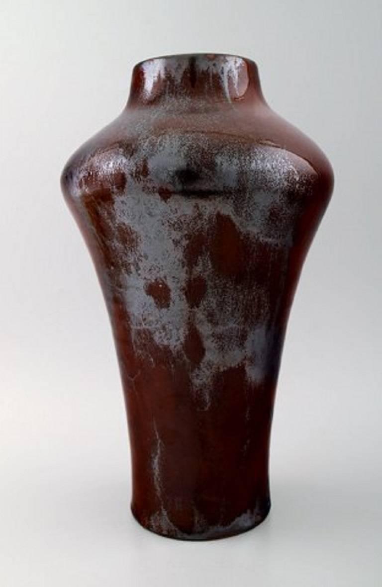 Large and impressive Kähler, luster glaze pottery vase, Karl Hansen Reistrup.

Formed by Herman Hans Christian Kähler.

Measures 32 x 18 cm. Beautiful luster glaze.

In perfect condition.

Signed HAK, circa 1920s