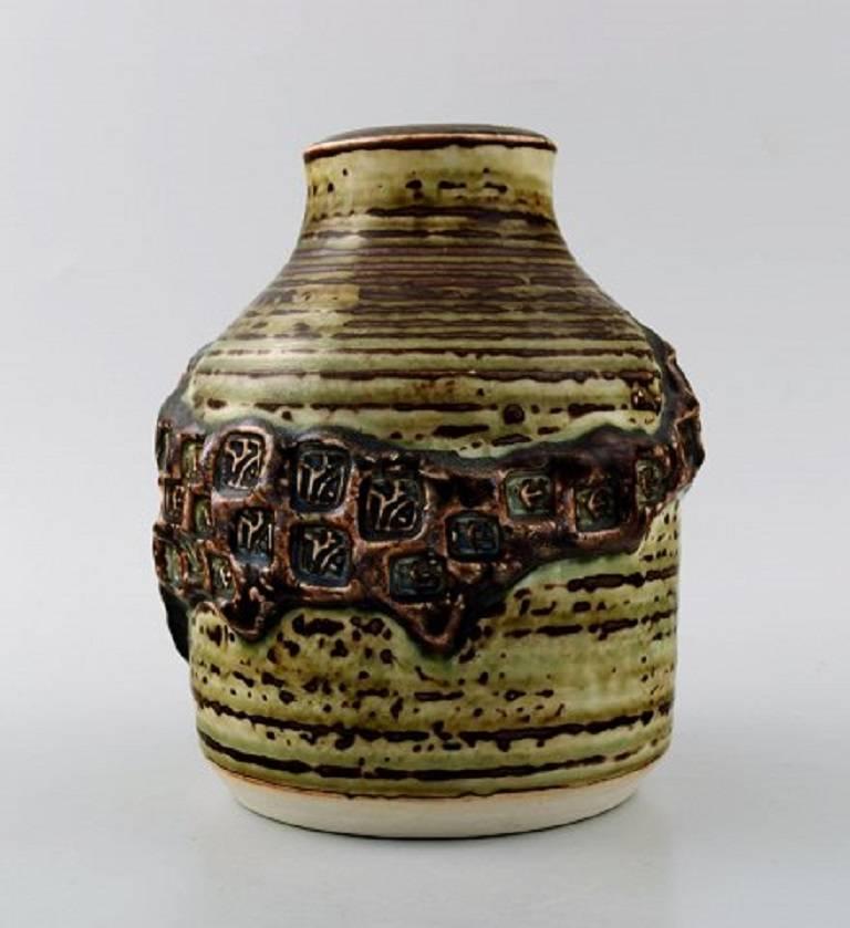 Royal Copenhagen stoneware vase Jørgen Mogensen, 1970s.

Size: 17 cm. high. 14 cm. in diameter.

Number: 21968

1st. factory quality. 

In perfect condition.