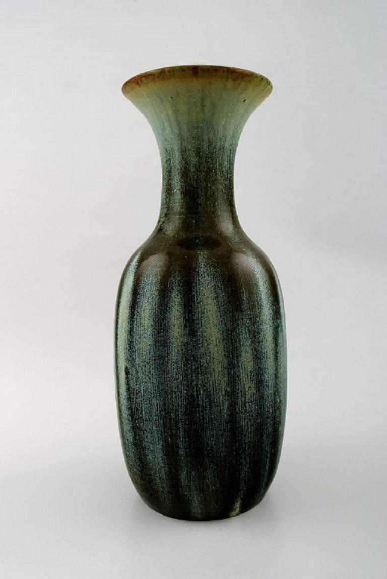 Unique Royal Copenhagen large ceramic vase by Carl Halier or Patrick Nordstrøm.

Beautiful glaze in many shades.

In perfect condition. 1st. factory quality.

Dated 2.1.25.

Measures: Height 28 cm, diameter: 13 cm.