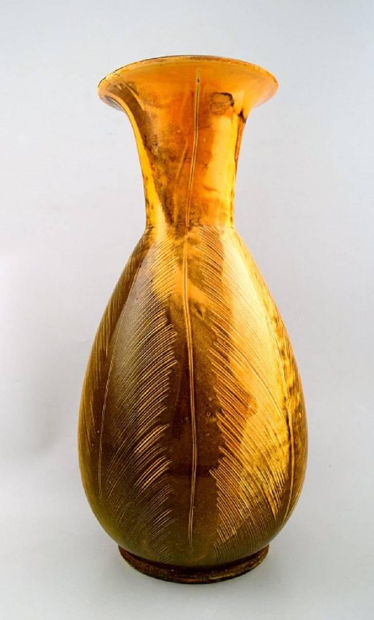 Large Kähler, Denmark, Svend Hammershoi, glazed floor vase in stoneware.
In perfect condition.
Beautiful uranium yellow glaze.
Stamped.
Measures 40 x 21 cm.
