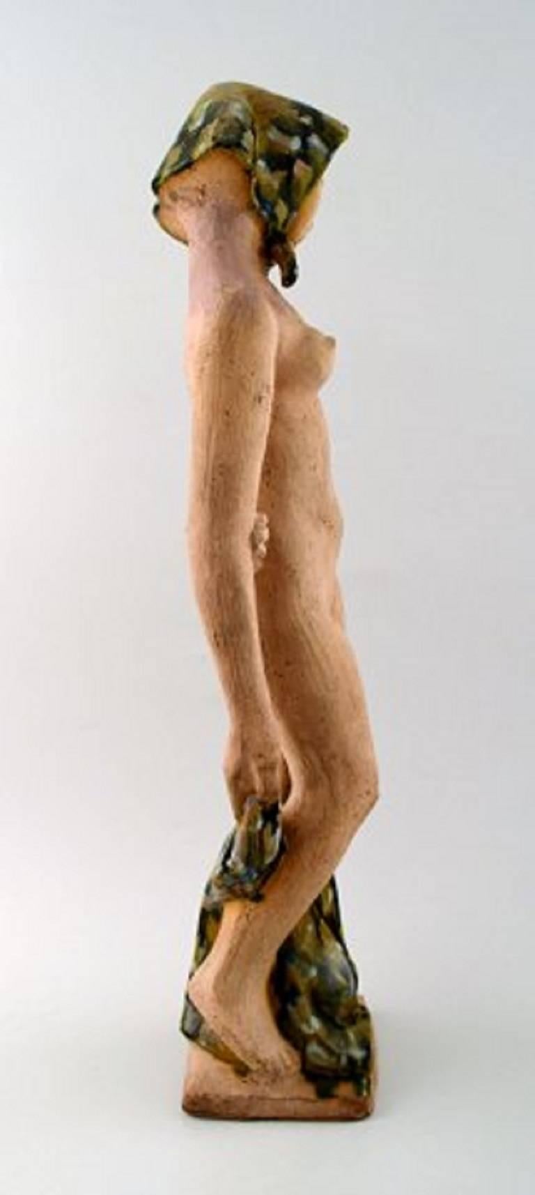 Helge Christoffersen, own workshop, very large unique figure of nude young model wearing scarf.
High quality ceramic sculpture, beautiful glaze.
Measures 50 x 11 cm.
In perfect condition.
Signed.