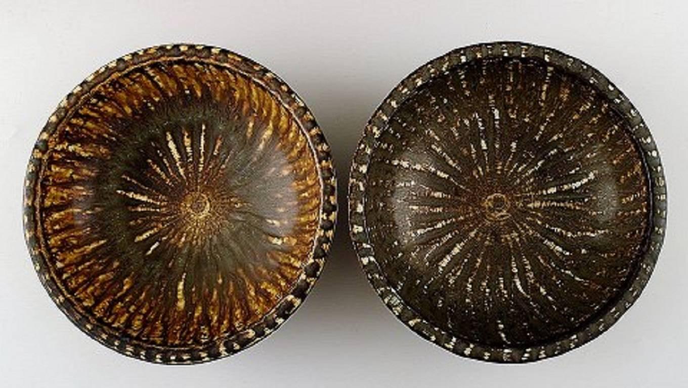 Rörstrand/Rørstrand Gunnar Nylund, a pair of ceramic bowls.
Measures 16 cm. x 6 cm.
Glaze in brown shades.
Stamped.
In perfect condition.
1st. factory quality.