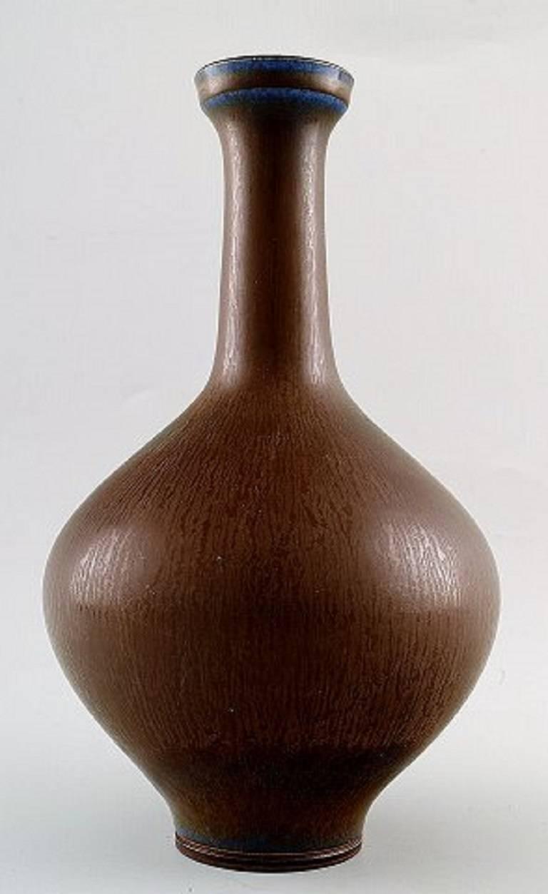 Early Berndt Friberg Studio large ceramic vase. 
Modern Swedish design. Unique, handmade.
Early stamp. From 1939-1945.
Fantastic glaze in blue brown tones.
Perfect condition. 1st. factory quality.
Measures: 21 cm. x 14 cm.