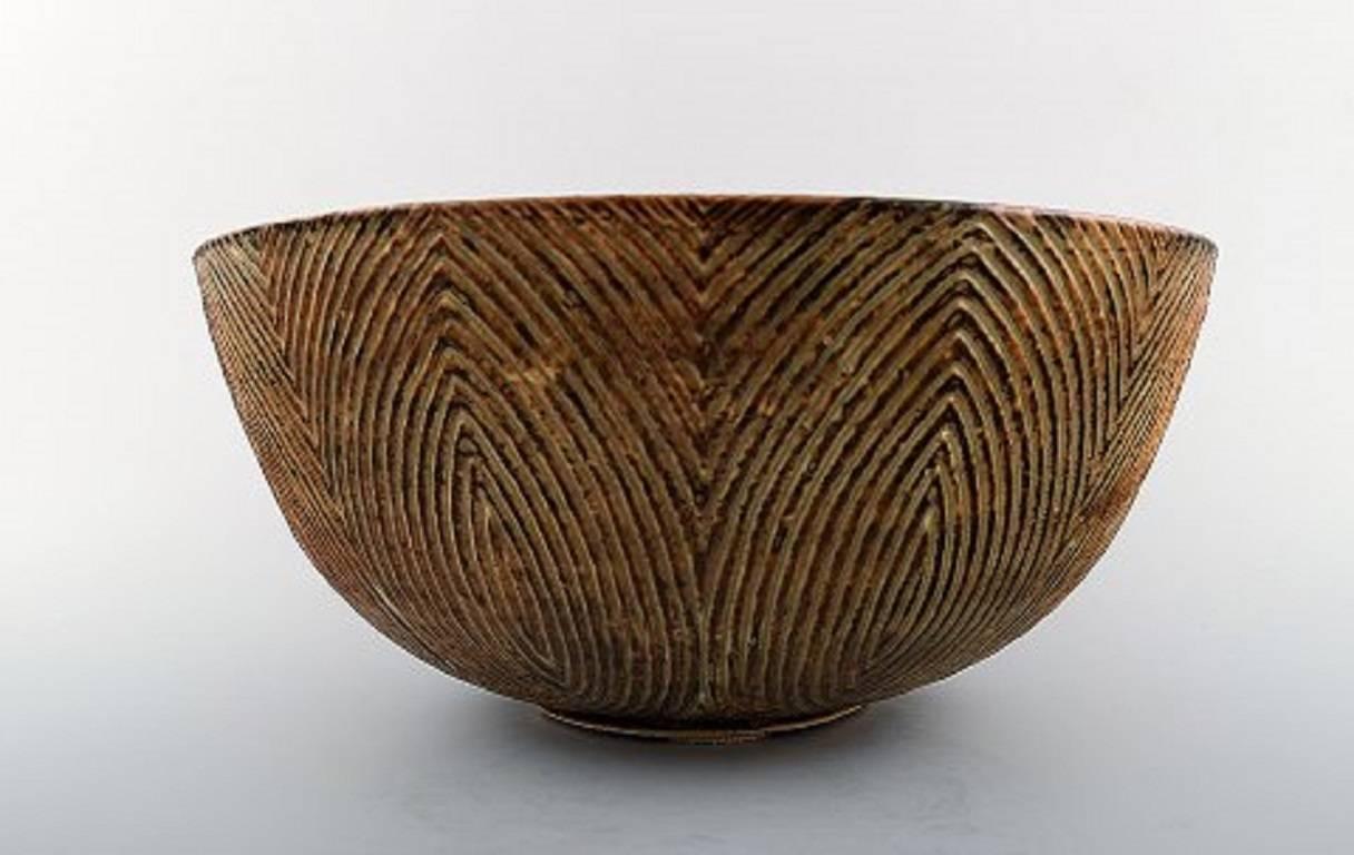 Axel Salto. Plained style, Royal Copenhagen. Very large bowl.
Brownish glaze.
Signed Salto. Number 20675.
Measures: Height 15 cm., diameter 29.5 cm.
1st. factory quality.
Perfect condition.