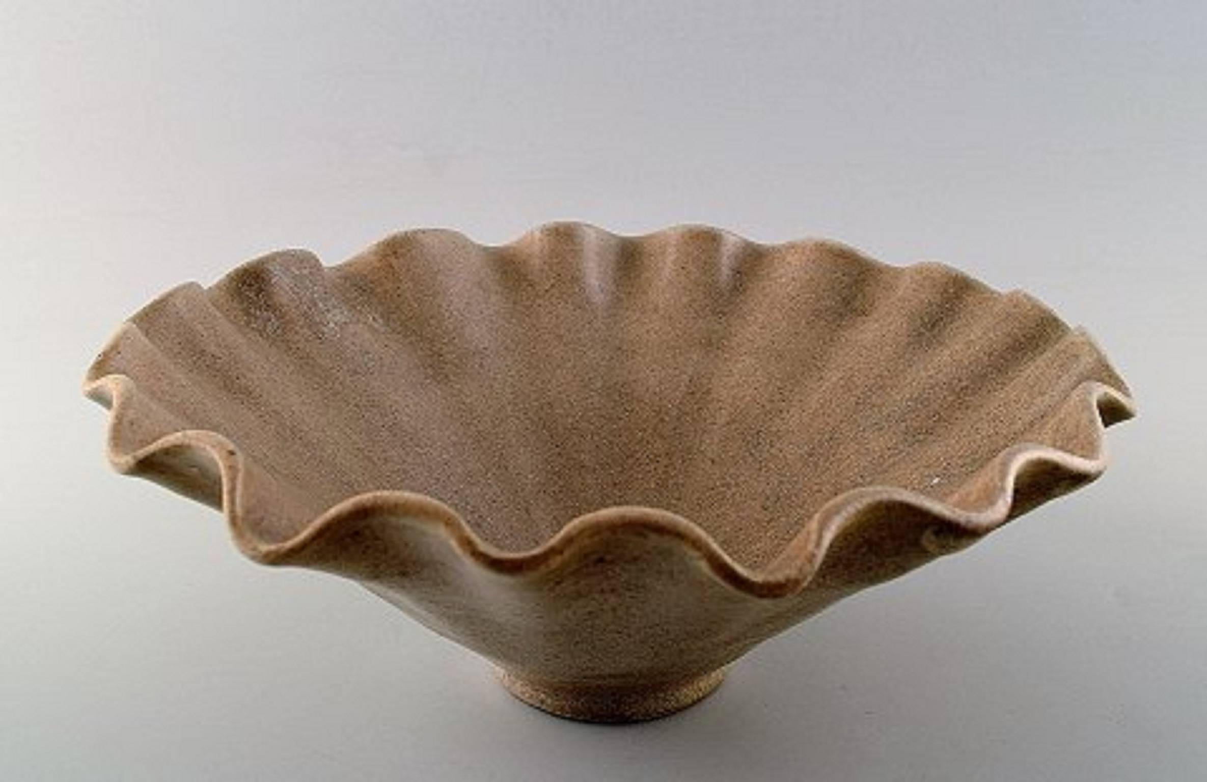 Arne Bang. Ceramics, large bowl.
Stamped AB 186. Beautiful glaze in sand colur shades.
In perfect condition. Height: 9 cm. Diameter: 23.5 cm.