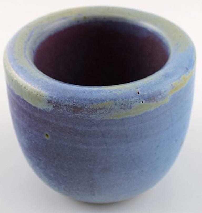 Christian Poulsen unique ceramic vase.

Marked 1937.

Glaze in blue and green nuances.

Measures 8 x 7 cm.