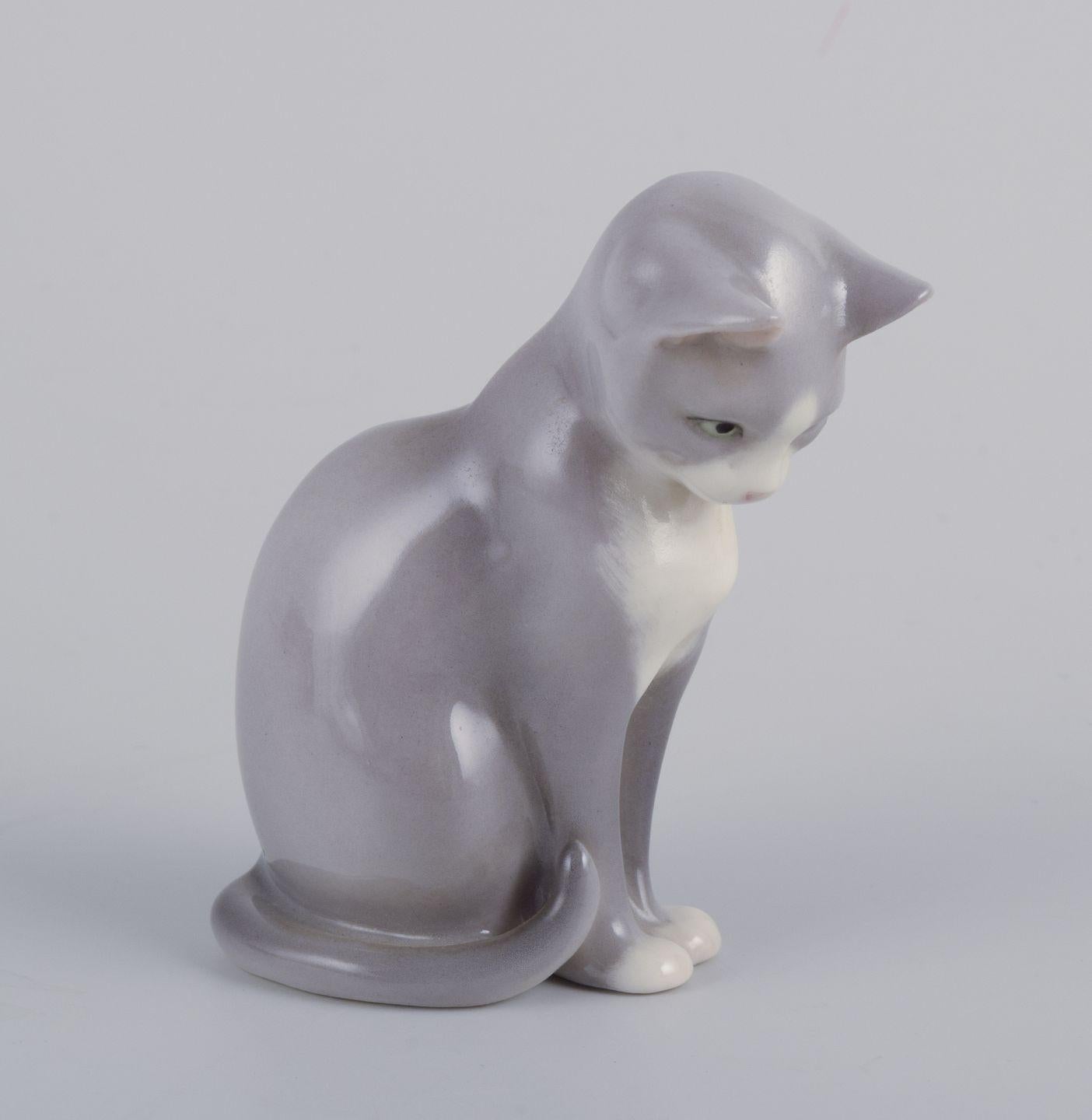 Royal Copenhagen. Porcelain figurine of a sitting cat. 21st C.